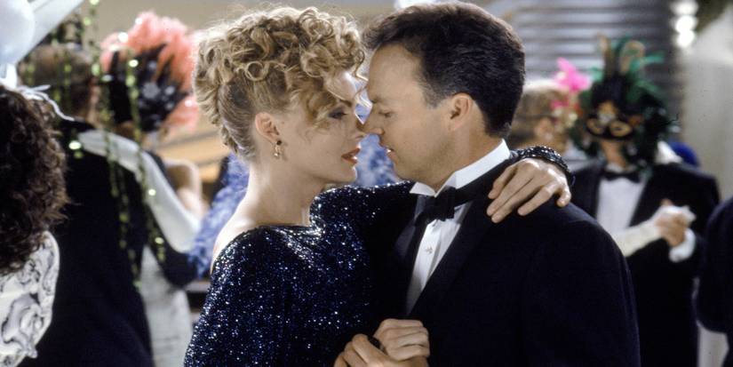 Bruce Wayne and Selina Kyle dancing at a black-tie party in Batman Returns