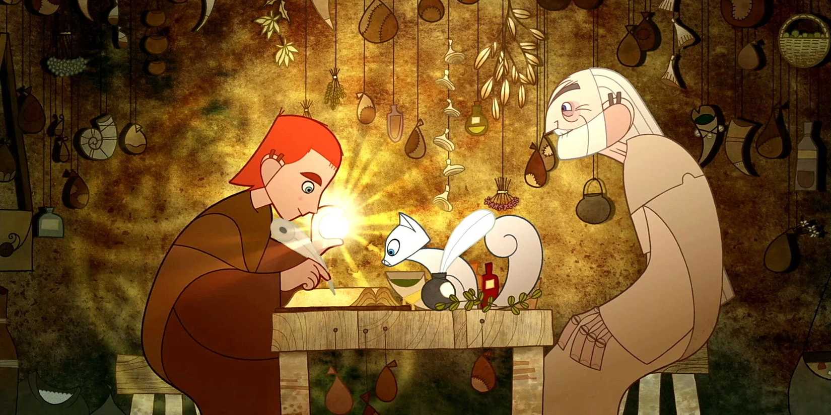 Brendan writing in a book with a quill while Aidan looks on in The Secret of Kells.