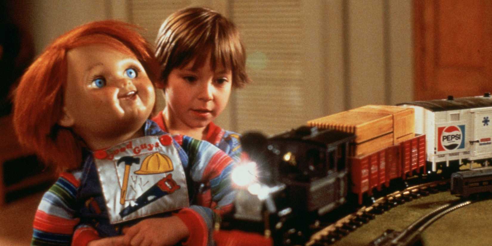 Alex Vincent as Andy Barclay plays with Chucky on a trainset in Child's Play