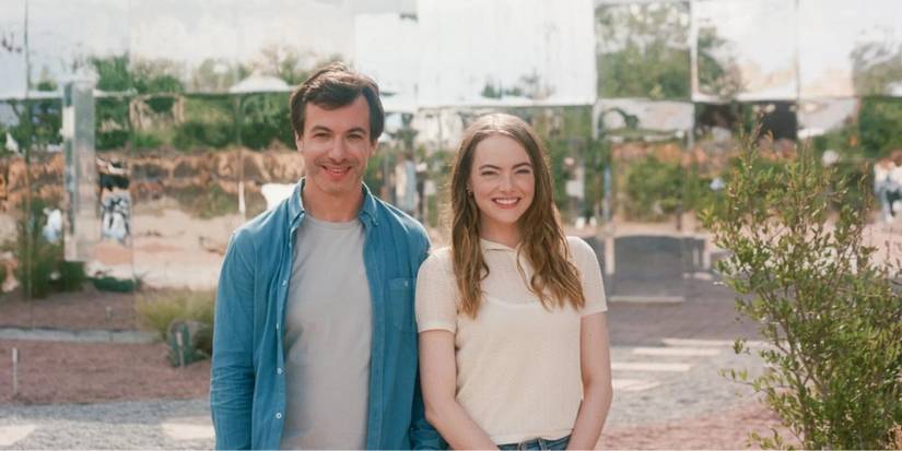 Nathan Fielder and Emma Stone smiling at the camera in The Curse