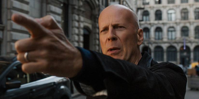Bruce Willis as Paul Kersey, pointing a finger gun, in the Death Wish remake