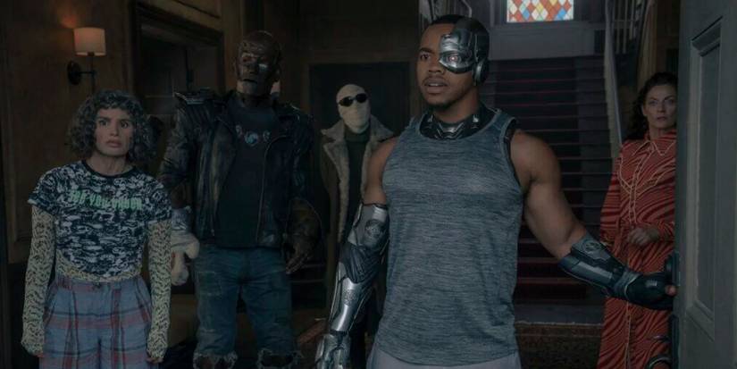 The Doom Patrol team opening the door to greet someone off camera