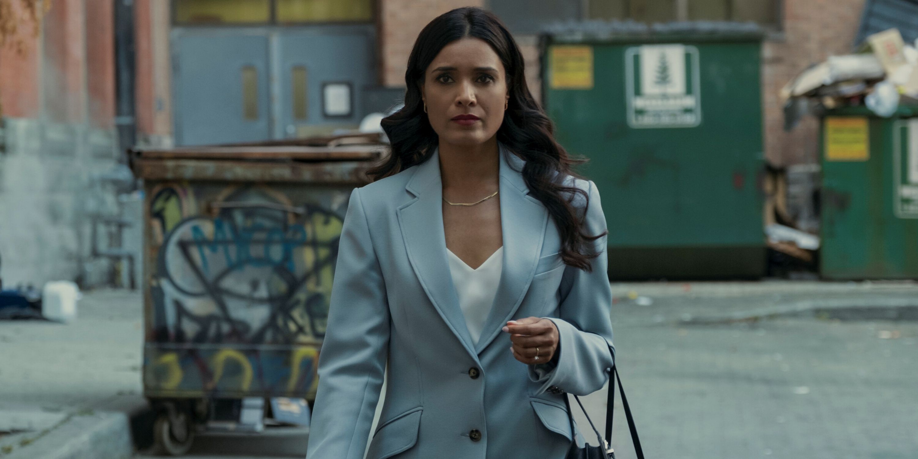Shelley Conn as Dean Shetty walking in an alley in Episode 7 of Season 1 of Gen V