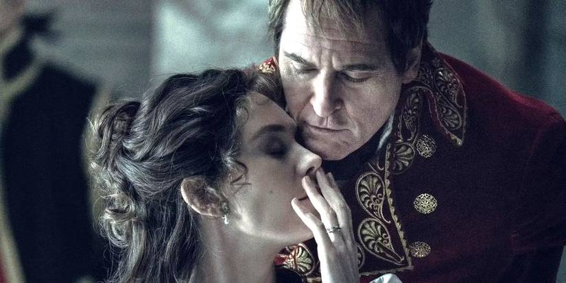 Joaquin Phoenix as Napoleon Bonaparte and Vanessa Kirby as Empress Josephine share a tender moment in Napoleon