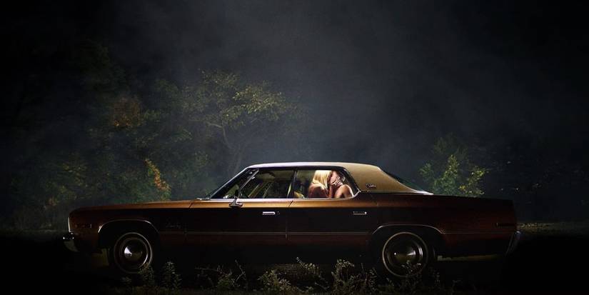 A couple making out in a car in 'It Follows'