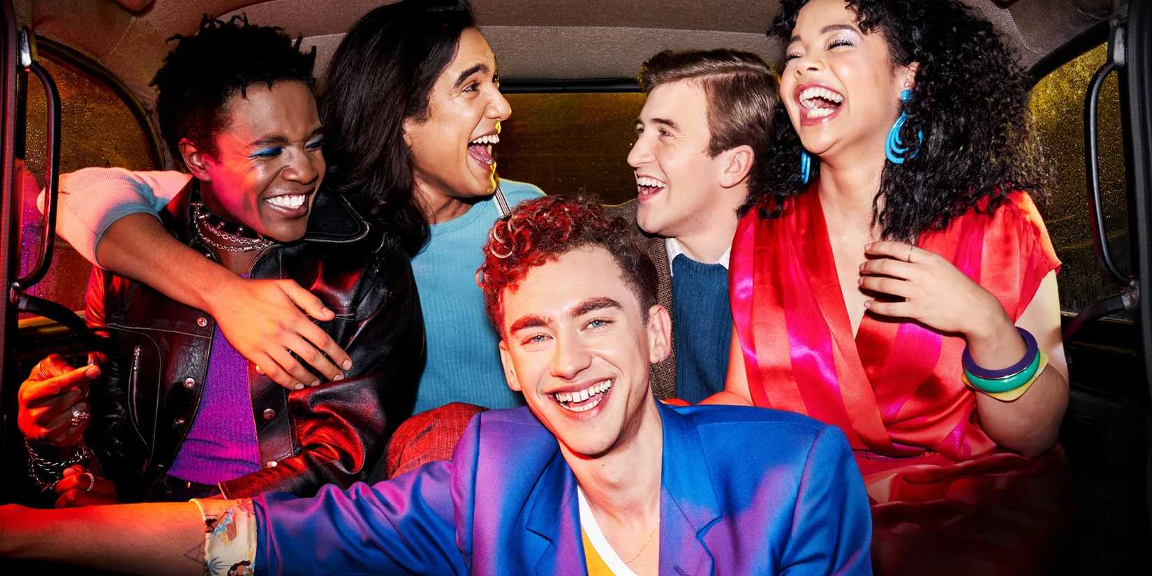 The cast of It's a Sin looking happy as they stand close together for the poster of the HBO series