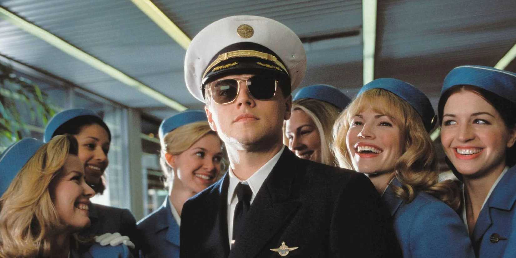 Frank Abagnale Jr. dressed as a pilot surrounded by air hostesses in Catch Me if You Can