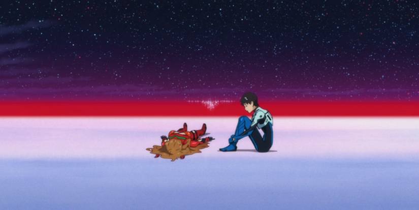 Shinji sitting down and looking at a lying woman in 'Evangelion: 3.0 + 1.0 Thrice Upon a Time'