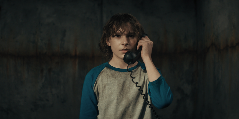 Finney (Mason Thames) on the phone in The Black Phone