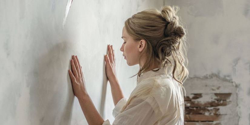 Mother pressing her hands against a wall in in mother! (2017)