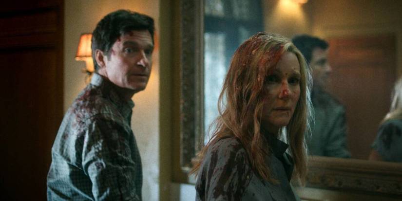 Marty and Wendy covered in blood standing by a mirror in Ozark.