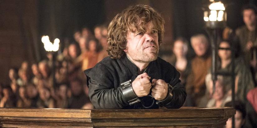 Peter Dinklage as Tyrion Lannister pleading his case in court with his hands chained in Game of Thrones.