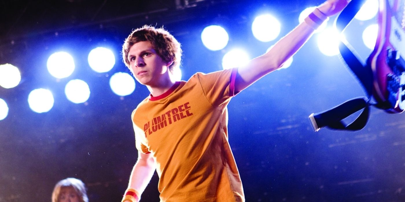 Michael Cera as Scott Pilgrim tosses his guitar aside as he gets ready to fight in Scott Pilgrim vs. The World