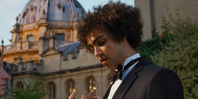 Farleigh Start (Archie Madekwe) wearing a suit in Saltburn