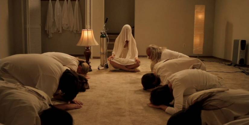 The cult followers worship a shrouded Brit-Marling in Sound of My Voice