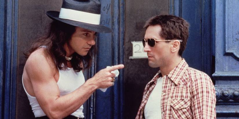 Robert De Niro as Travis Bickle and Harvey Keitel as Matthew "Sport" Higgins arguing in Taxi Driver.