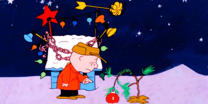 Charlie Brown sadly pointing at a tiny tree weighed down by a red ornament in A Charlie Brown Christmas.