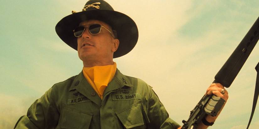 Robert Duvall as Lieutenant Colonel William "Bill" Kilgore, wearing a hat and holding a rifle in Apocalypse Now