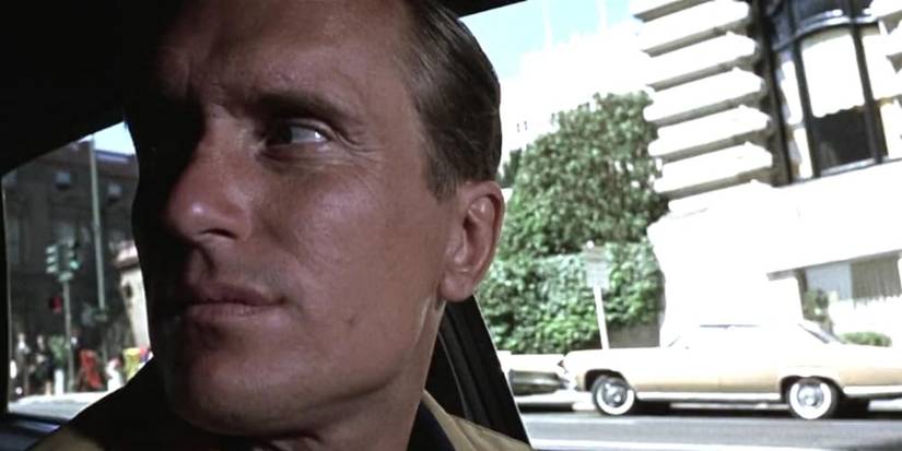 Robert Duvall in 'Bullitt’ (1968), looking over his shoulder in a car