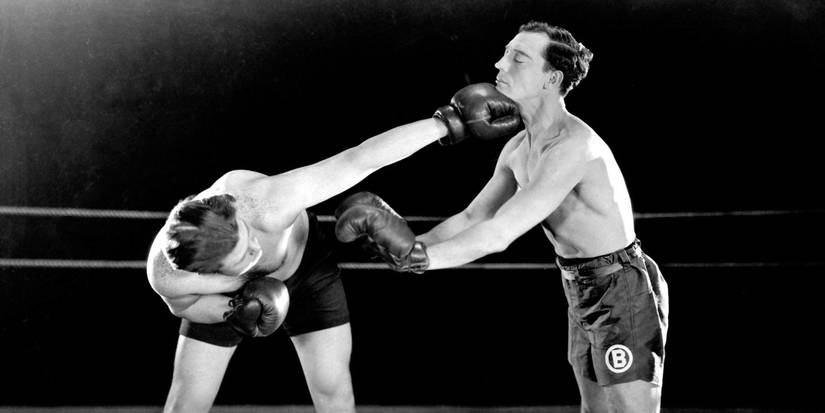 Buster Keaton getting punched in the chin during a boxing match in Battling Butler
