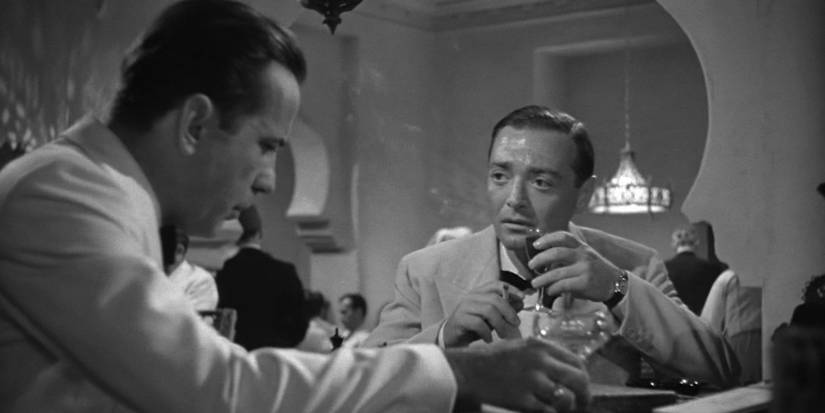 Uagarte (Peter Lorre) sharing a drink with Rick Blaine (Humphrey Bogart) in 'Casablanca'