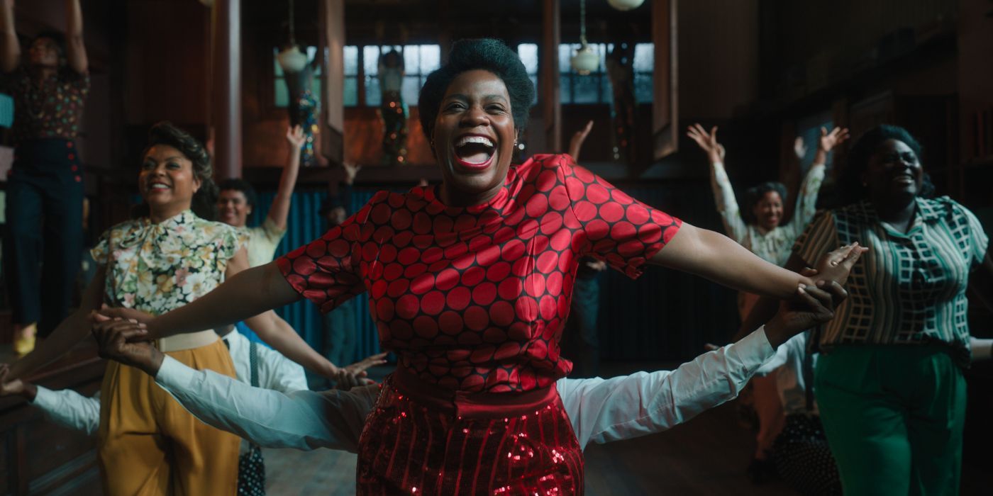 Celie (Fantasia Barrino) singing and dancing with the cast from The Color Purple