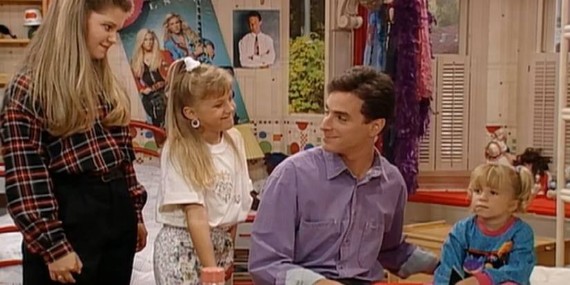 Danny Tanner with his daughters on Full House.