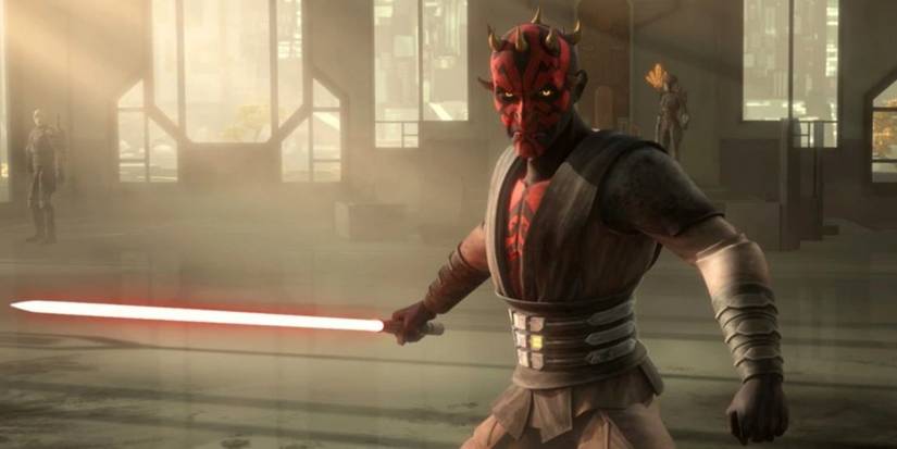 Darth Maul holds a red lightsaber in Star Wars: The Clone Wars