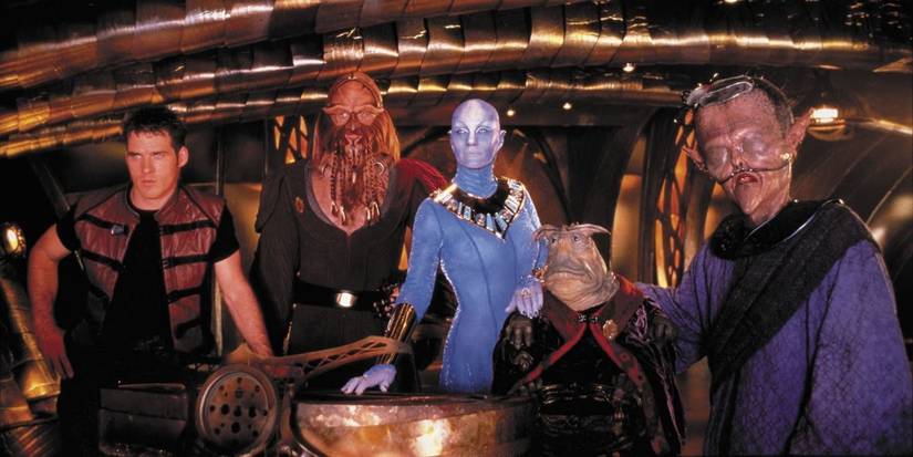 John Crichton, D'Argo, Zhaan, Rygel, and T'raltixx standing close together on Moya's bridge for the Farscape episode Crackers Don't Matter