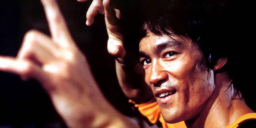Billy Lo smiling while on an attack pose in Game of Death