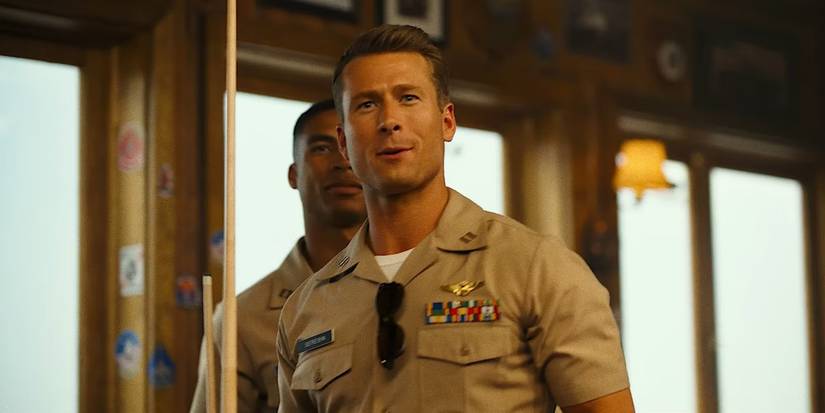 Glen Powell as LT Jake "Hangman" Seresin looking surprised in Top Gun: Maverick.