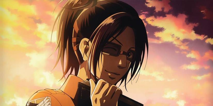 Hange Zoe winking and smiling with a book in Attack on Titan