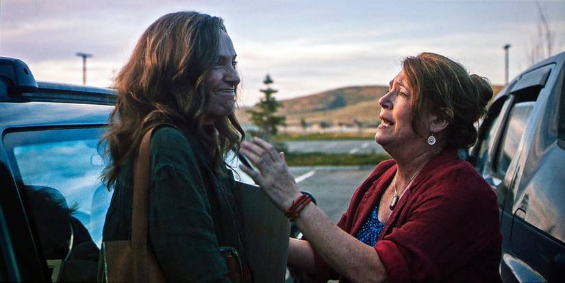 Two women have a conversation in a parking lot in Hereditary.