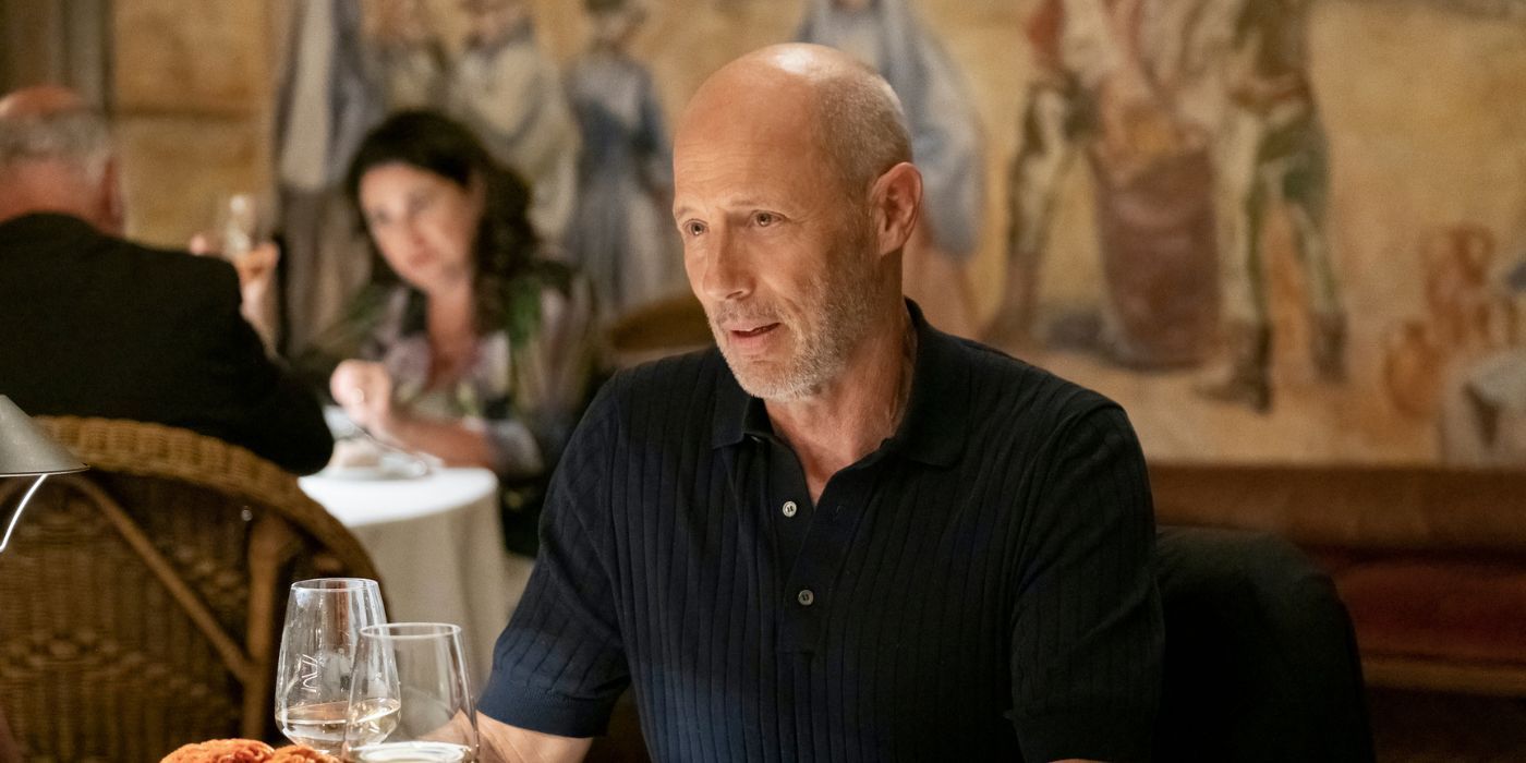 Greg (Jon Gries) sitting at a restaurant in The White Lotus Season 2