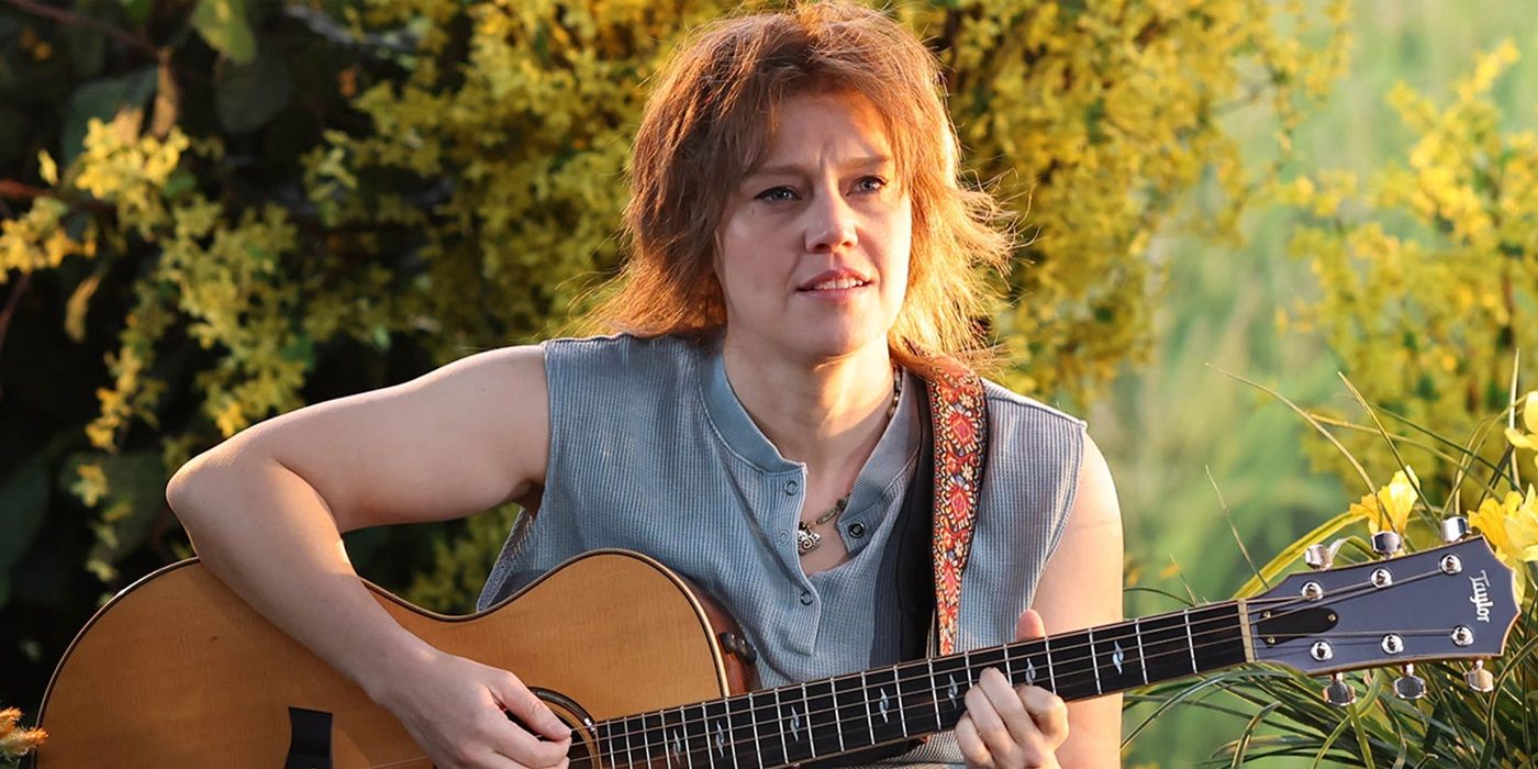 Kate McKinnon playing a guitar during the tampon farm sketch on Saturday Night Live