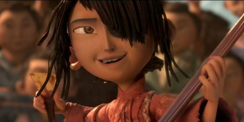 Kubo from Kubo and the Two Strings smiling while in an attack pose