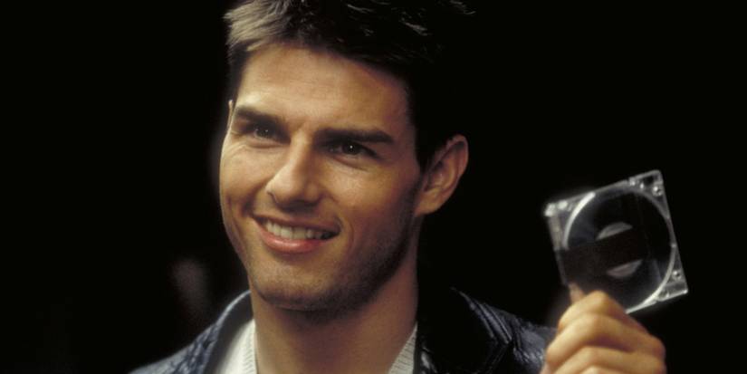 Tom Cruise holding a disc in Mission: Impossible