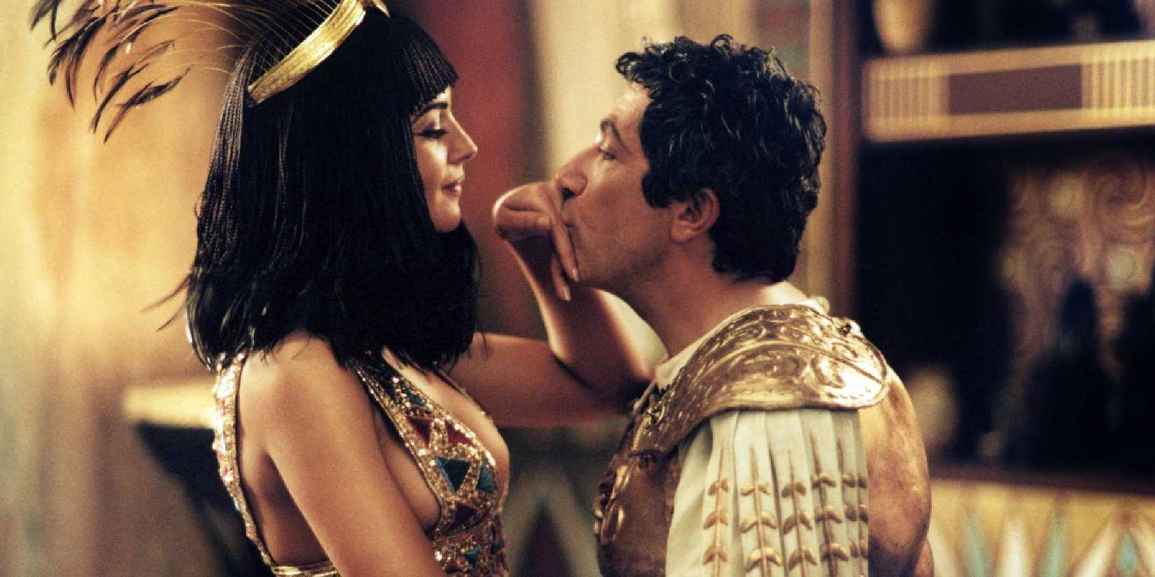 Alain Chabat kissing Monica Bellucci's hand in Mission Cleopatra