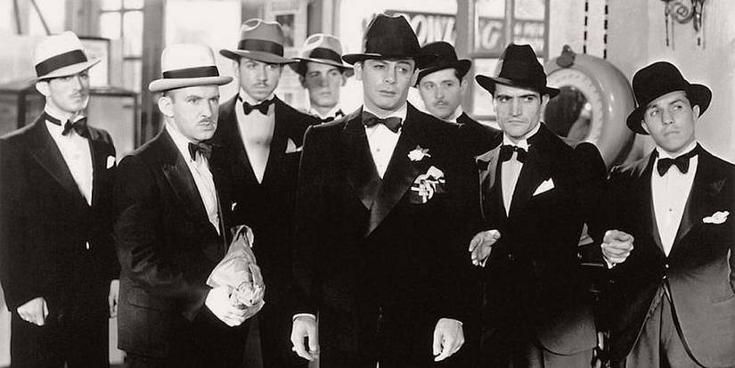Paul Muni and a group of men in tuxedos in Scarface 1932