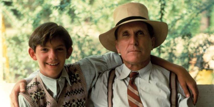 Lukas Haas and Rubert Duvall with their arms over each other's shoulders in 'Rambling Rose’ (1991)  (1)