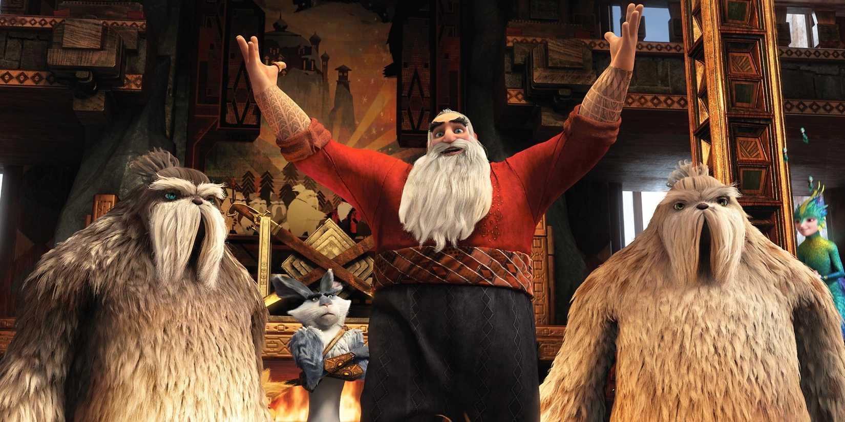 Santa Claus raising his arms while his Yetis stand behind him in Rise of the Guardians.