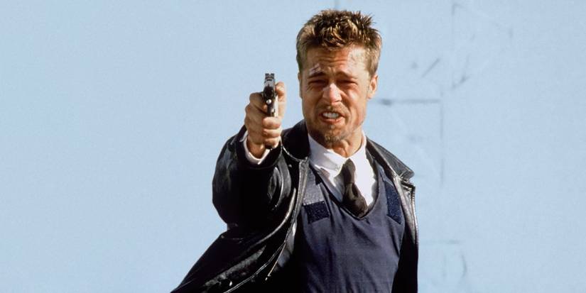 Detective Mills (Brad Pitt) crying and aiming a gun outside in Seven.