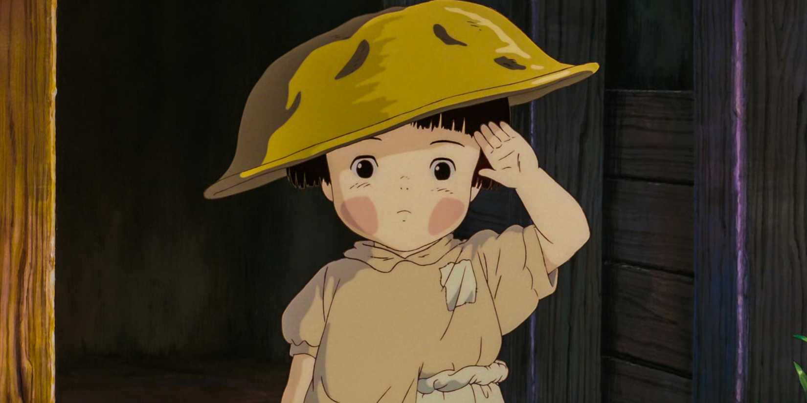 Setsuko saluting with a golden bowl on her head in 'Grave of the Fireflies'
