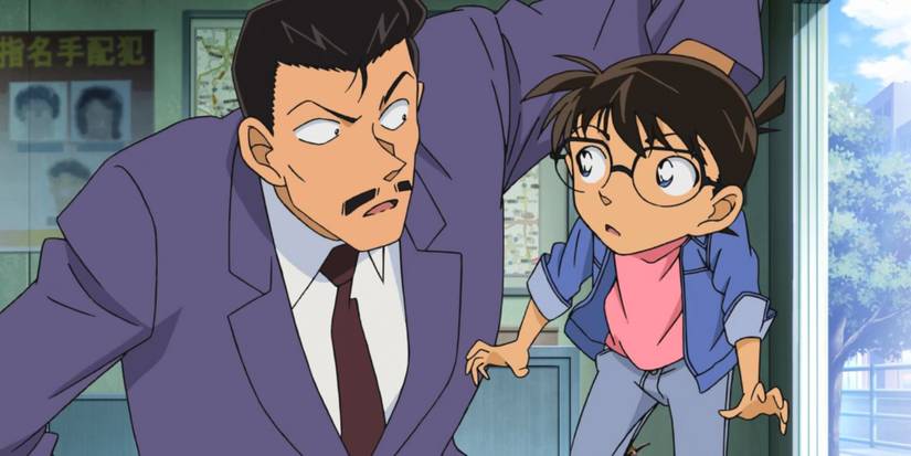 Conan Edogawa being reprimanded by Kogoro Mouri during an investigation in Detective Conan.