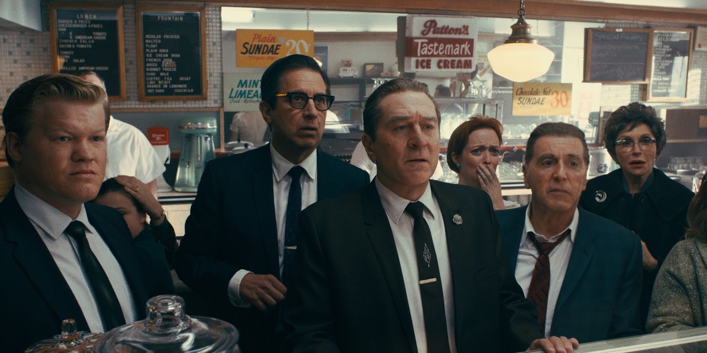 Frank Sheeran (Robert De Niro), Jimmy Hoffa (Al Pacino), Bill Buffalino (Ray Romano), and Chuckie O'Brien (Jesse Plemons) reacting to news of the JFK assassination in 