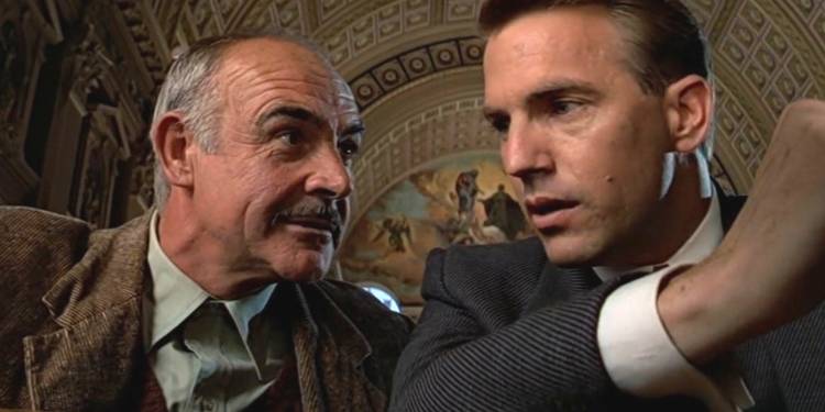 Sean Connery and Kevin Costner as Jim Malone and Eliot Ness talking in The Untouchables.