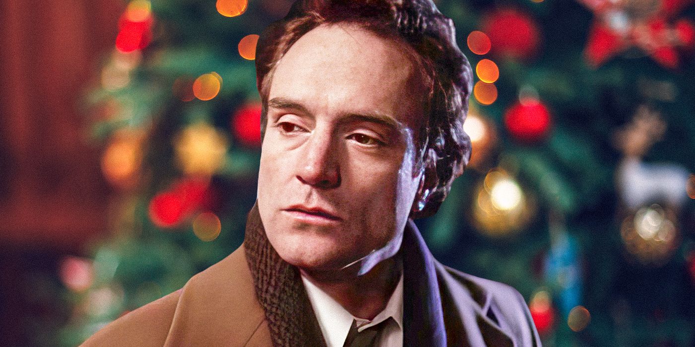 Bradley Whitford as Josh Lyman standing in front of a Christmas tree in The West Wing