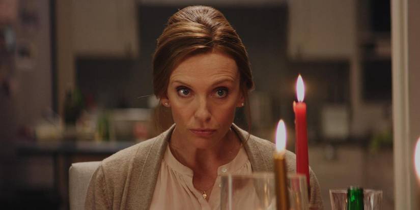 Toni Collette at the dinner table in Krampus