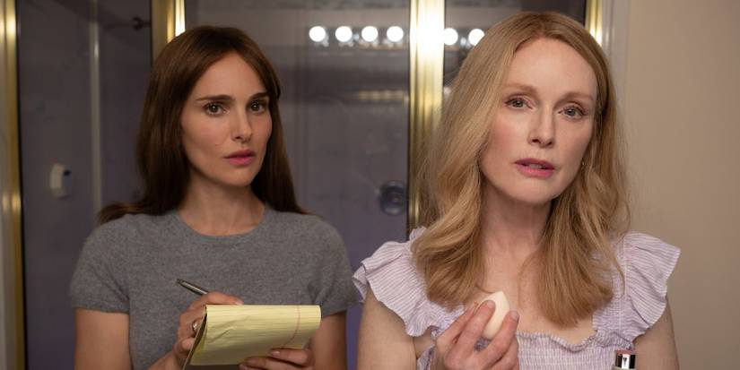 Elizabeth and Gracie looking at each other while facing a mirror in 'May December'