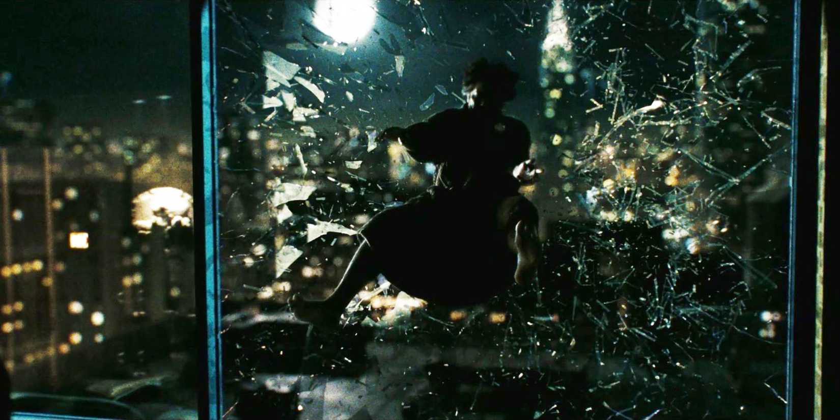 The Comedian (Jeffrey Dean Morgan) being thrown out a window in 'Watchmen.'